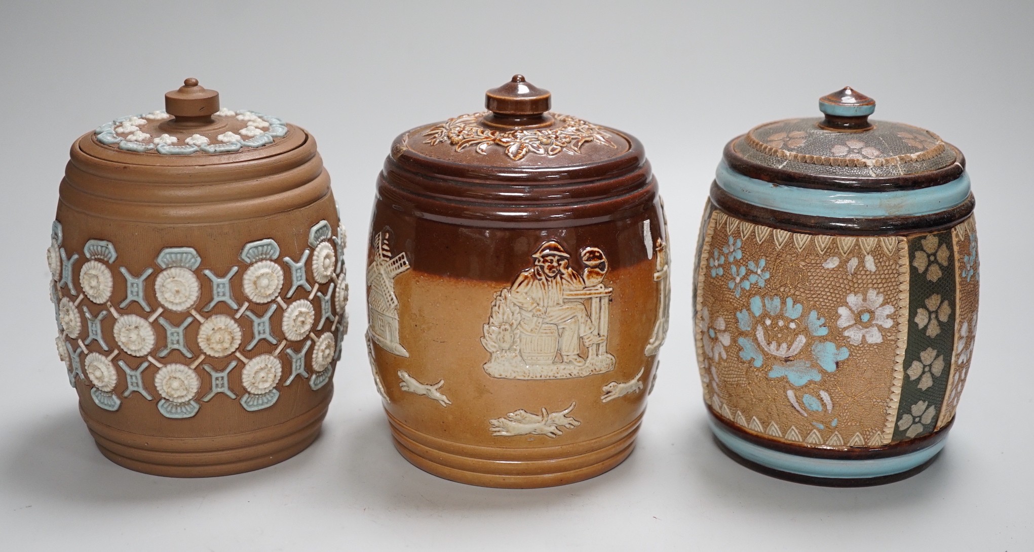 A quantity of Doulton stoneware tobacco jars and jugs